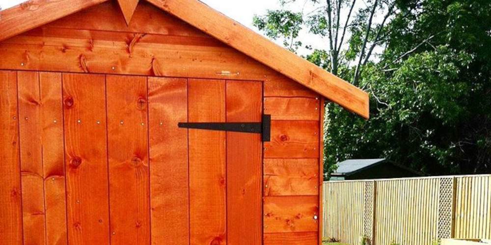 A picture containing a wooden timber shed