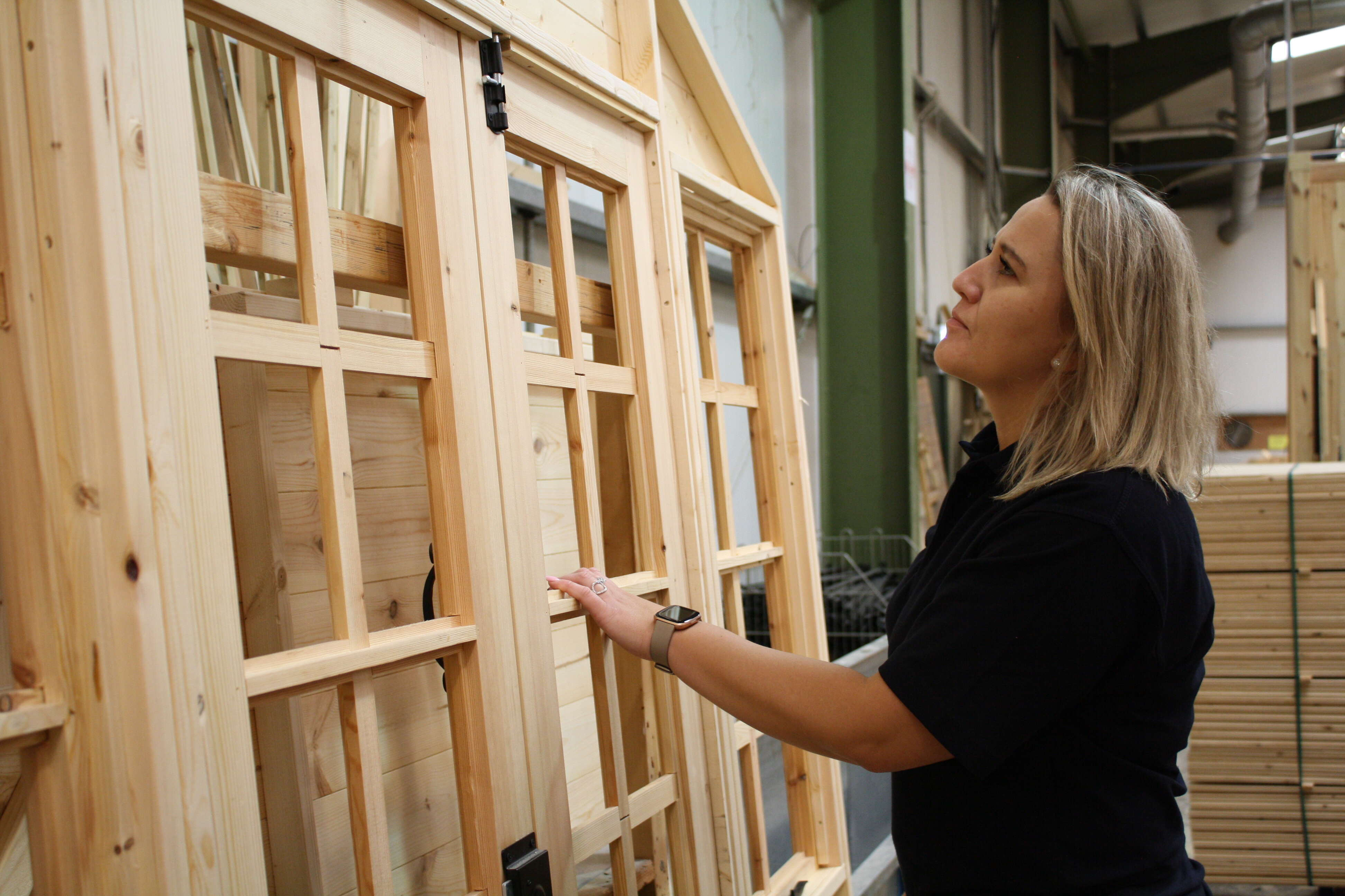 A picture containing Agata Choma, Head of Operations, Factory, Workshop, Tiger Sheds
