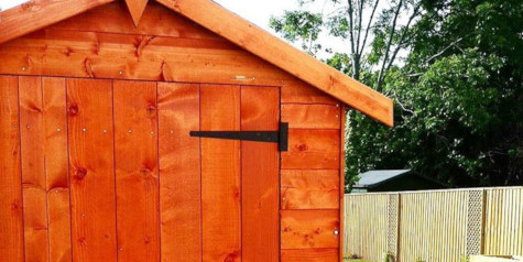 A picture containing a wooden timber shed