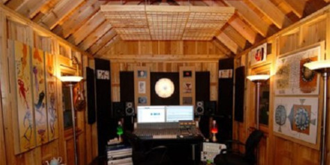 A picture containing a wooden shed interior with soundproofing