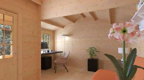 Tiger Sheds The Amur Log Cabin interior with desk, sofa and flowers