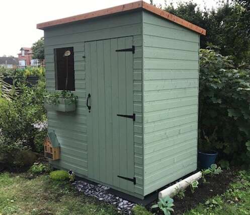 A small green Tiger pent shed