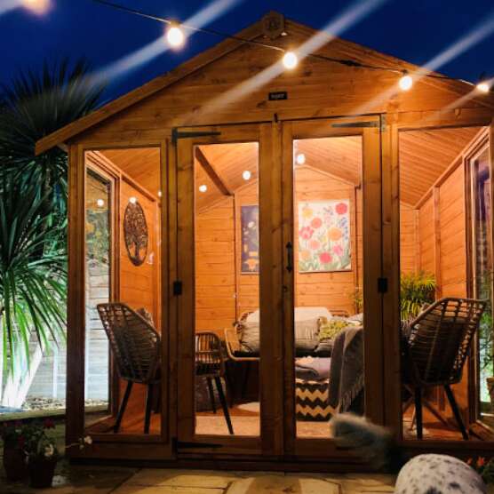 Tiger Contemporary Summerhouse with garden furniture and plants