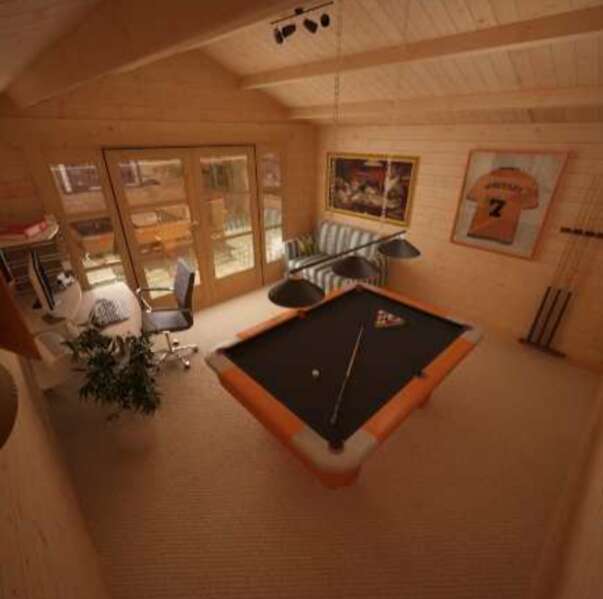 A picture containing the Tiger Siberian Log Cabin interior with pool table, framed football shirt, desk and chair, family garden room, family games room, garden games room