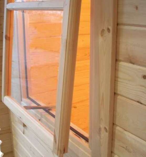 A picture containing an open log cabin window