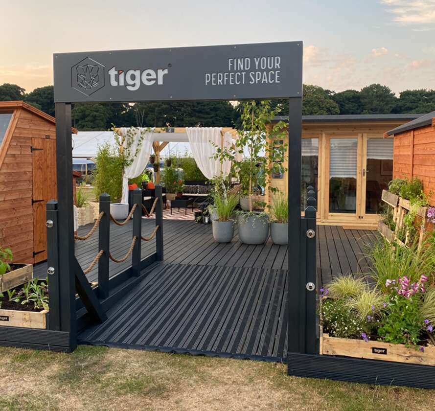 A picture containing Tiger Sheds RHS stand, garden, exhibition