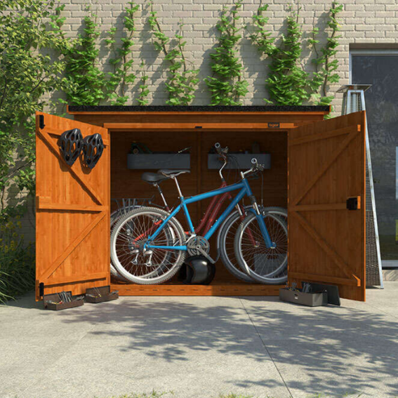 A bicycle in a wooden pent bike shed