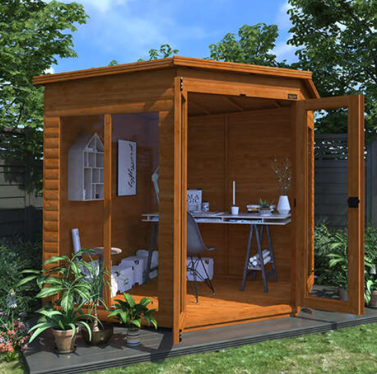 A picture containing a corner wooden summerhouse with a desk and chair