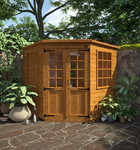 A picture containing a corner wooden summerhouse, garden, plants, patio