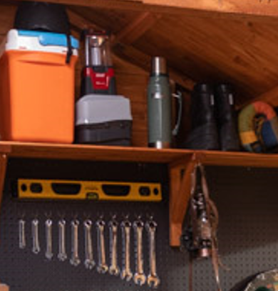 A picture containing a shed with wooden storage shelves