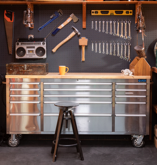 A picture containing a tool cabinet with drawers