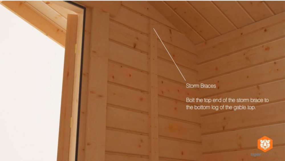 Storm braces installed in a log cabin
