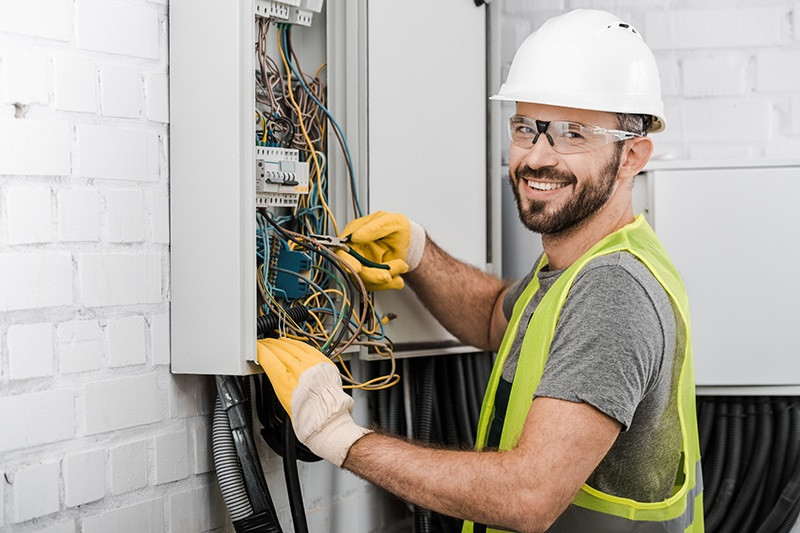 Electrician at a fuse box