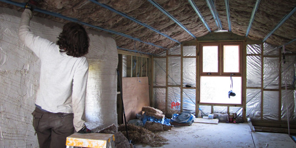 Man installing rockwool insulation