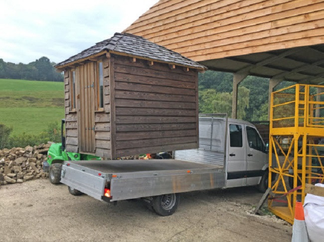 Shed being moved on trailer